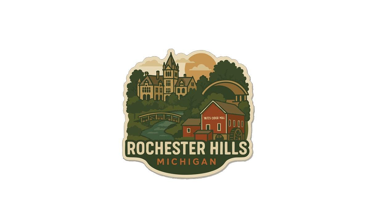 A sticker or emblem featuring a scenic landscape with a castle, a bridge, and a red building, along with the text "Rochester Hills, Michigan".