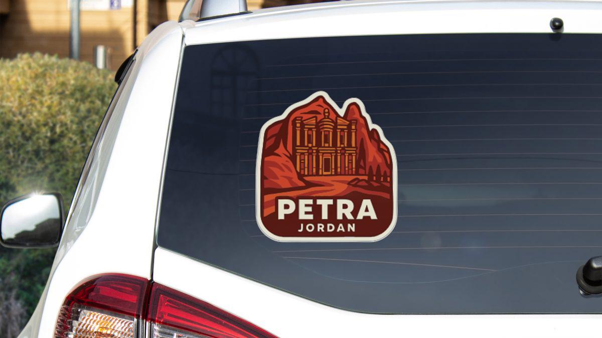 a sticker on the rear window of a car, depicting the Petra Jordan landmark.