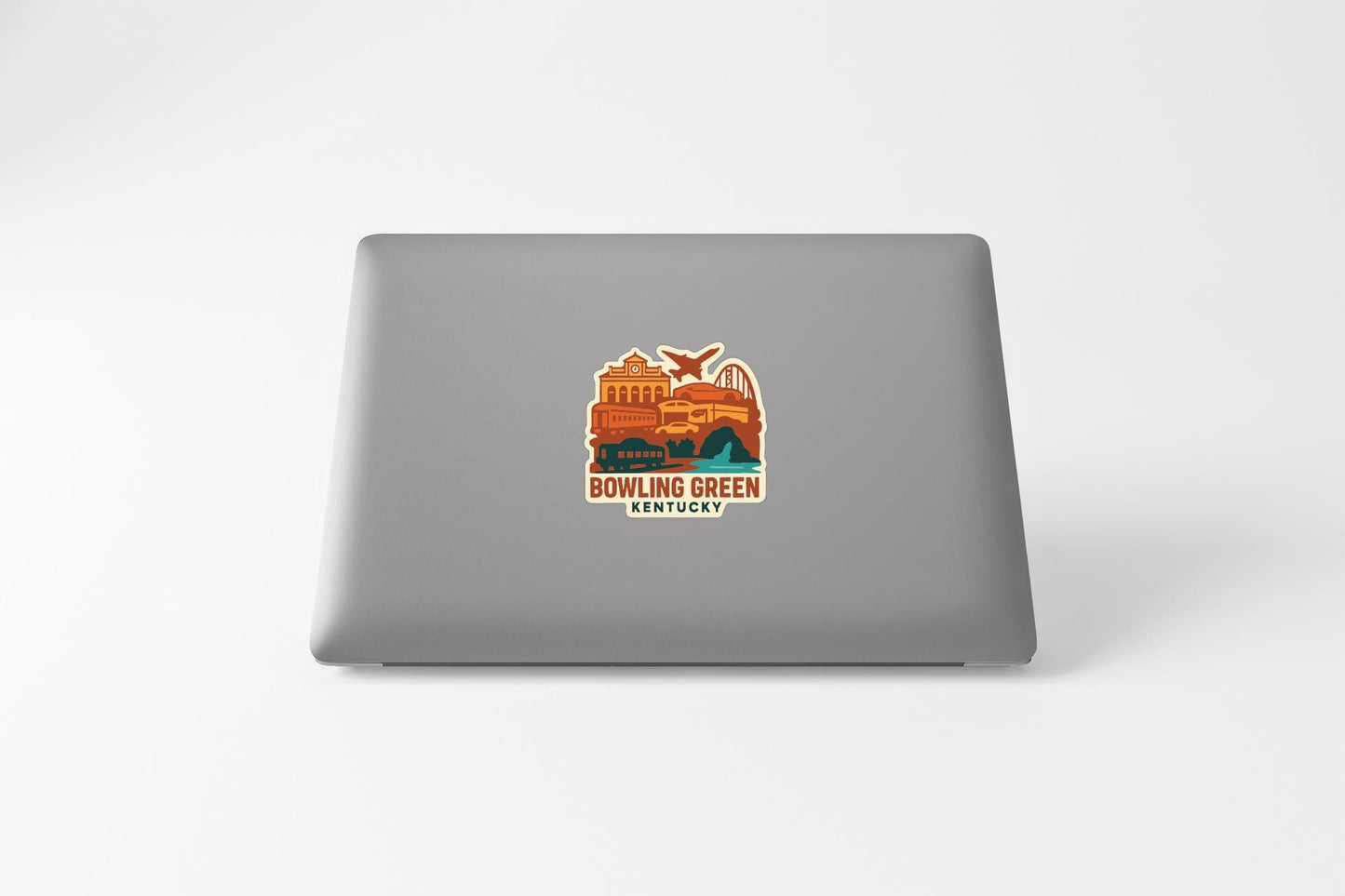 a sticker on the back of a laptop that says "BOWLING GREEN KENTUCKY".