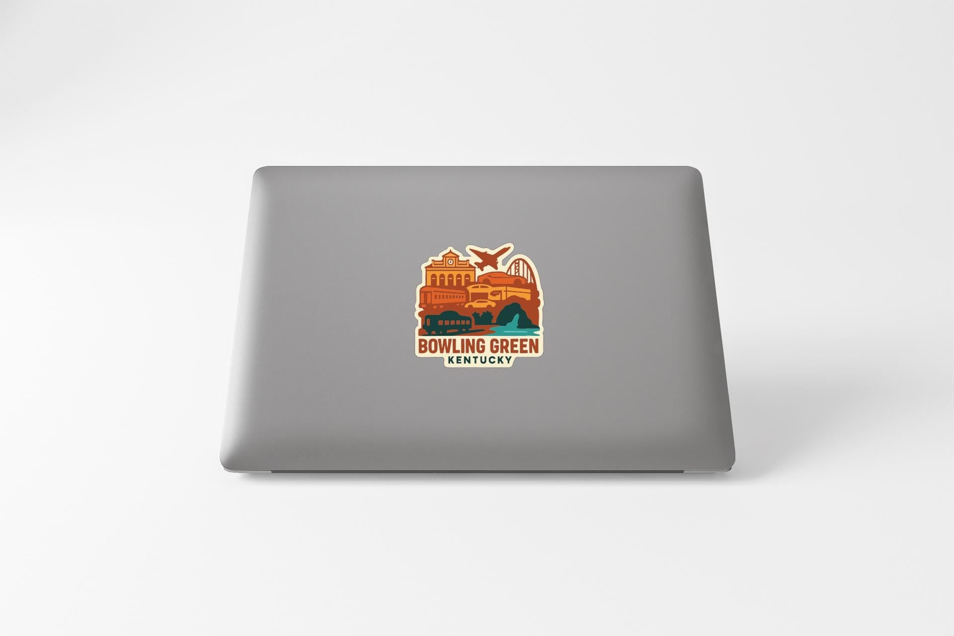 a sticker on the back of a laptop that says "BOWLING GREEN KENTUCKY".