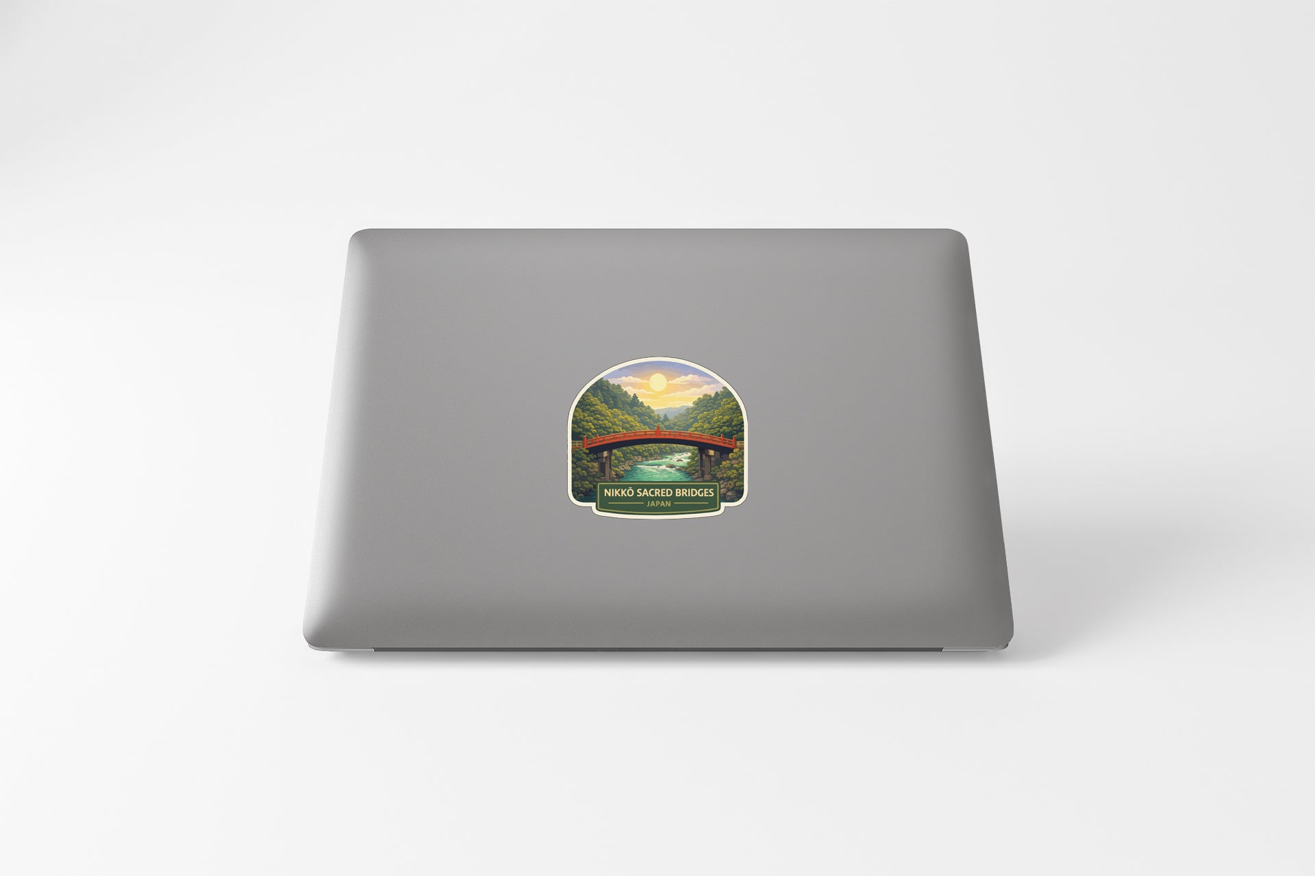 A sticker depicting a scenic landscape with a bridge in the background.