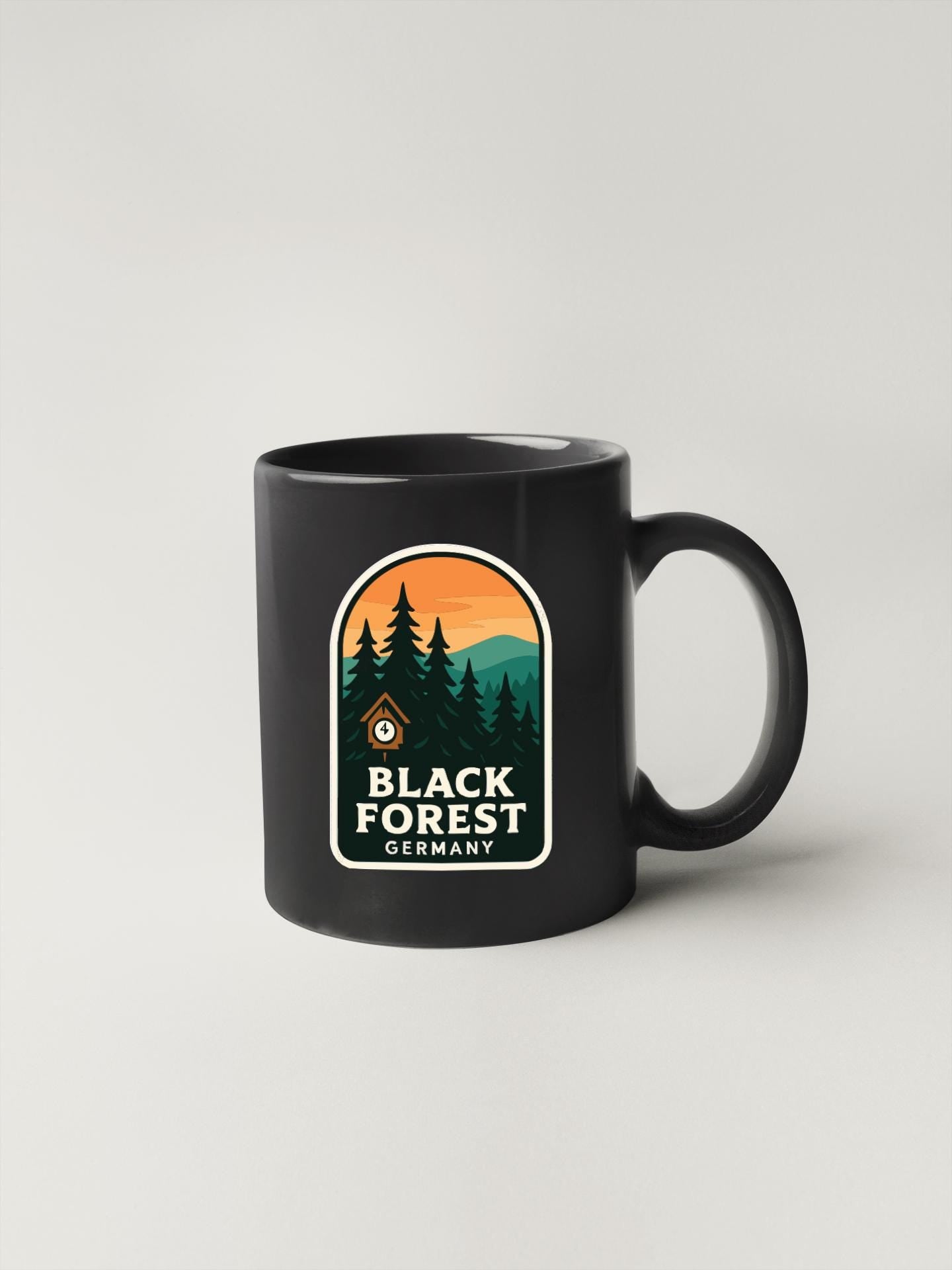 A black coffee mug with a logo that says "Black Forest Germany".