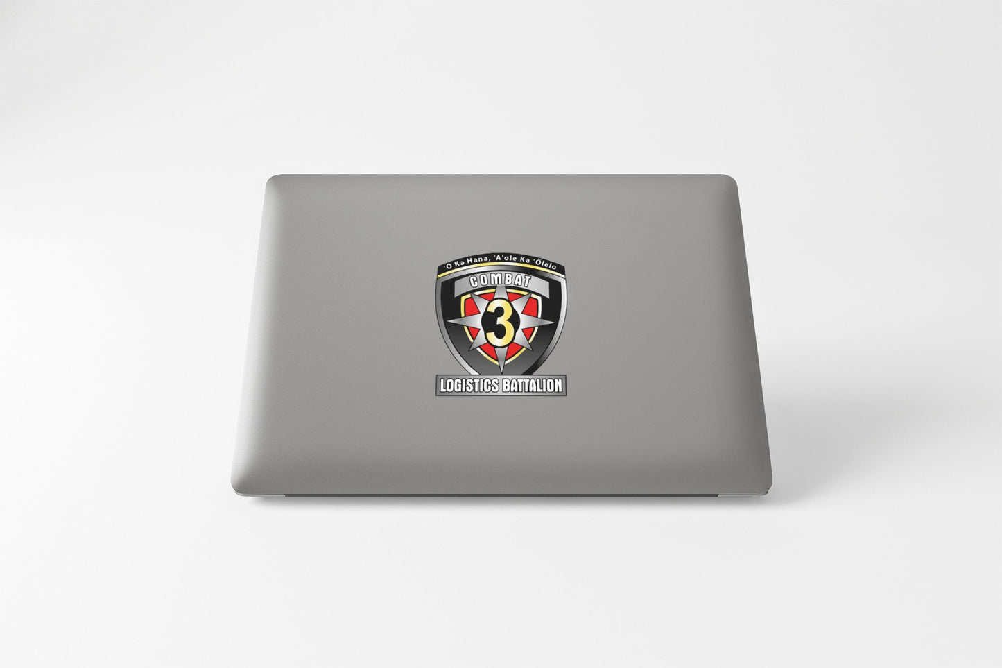 a laptop computer with a black and red shield on it