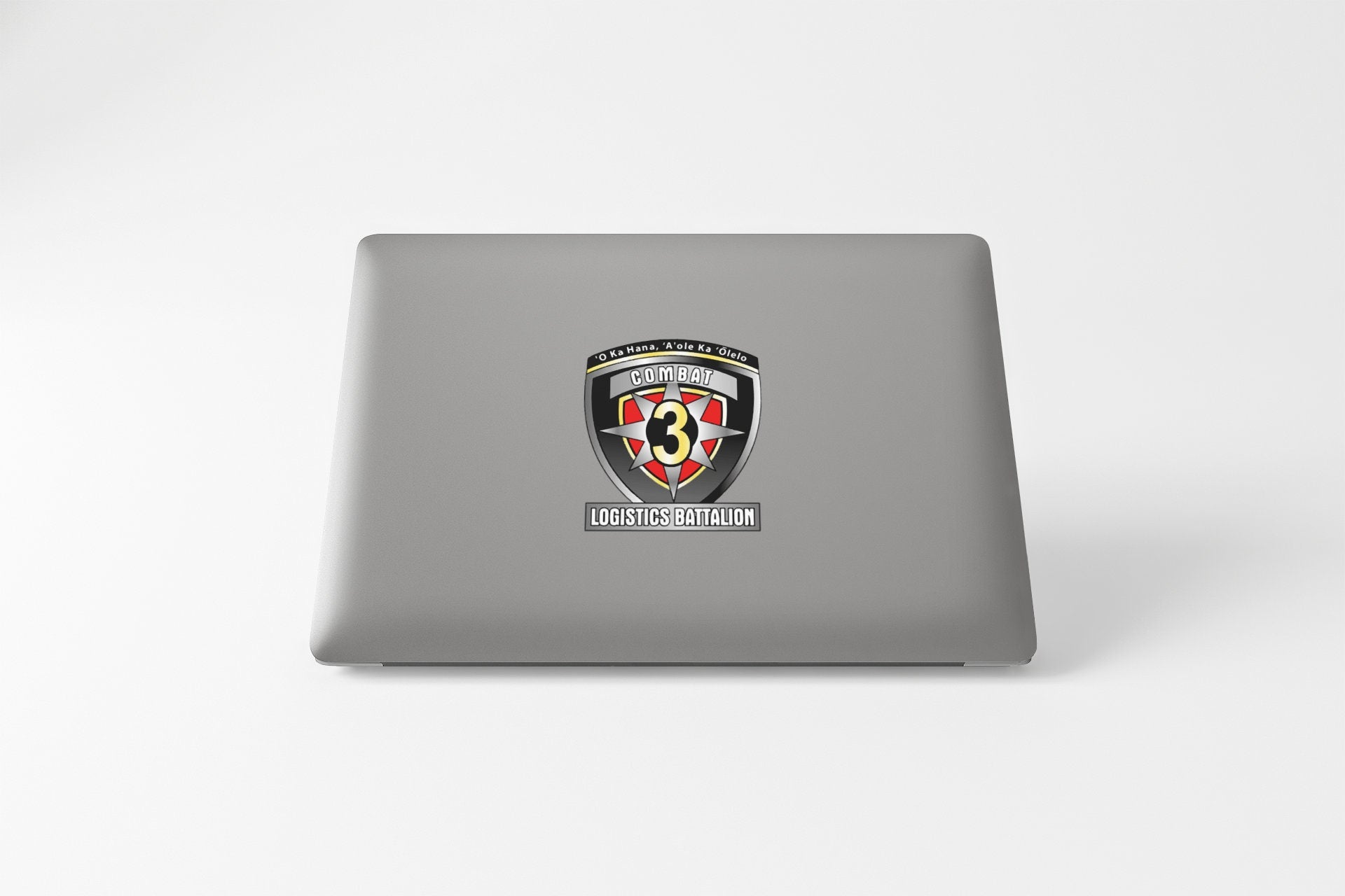 a laptop computer with a black and red shield on it