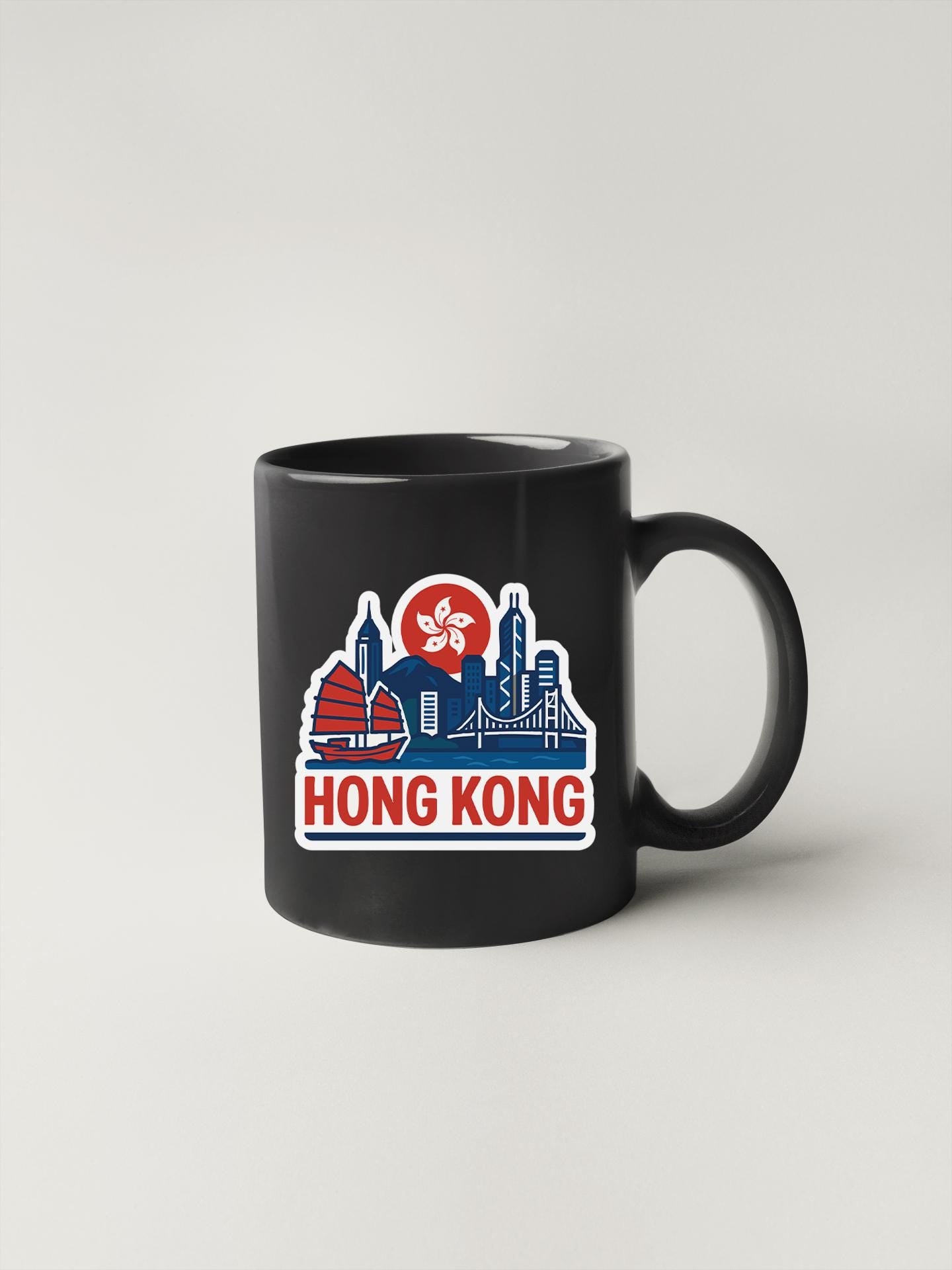 a black coffee mug with the words hong kong on it