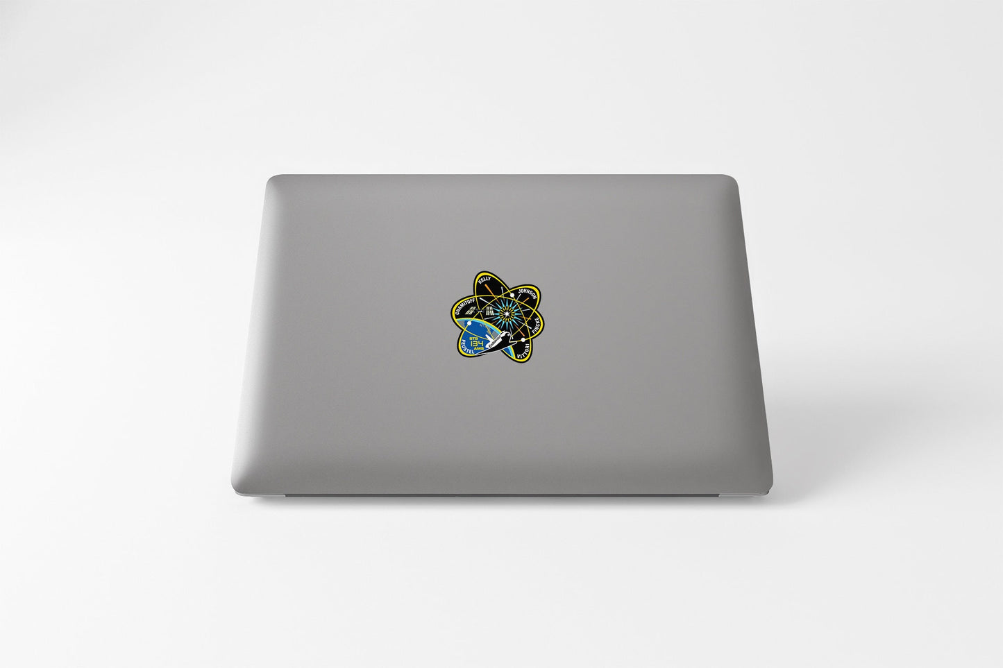 a laptop computer sitting on top of a white table