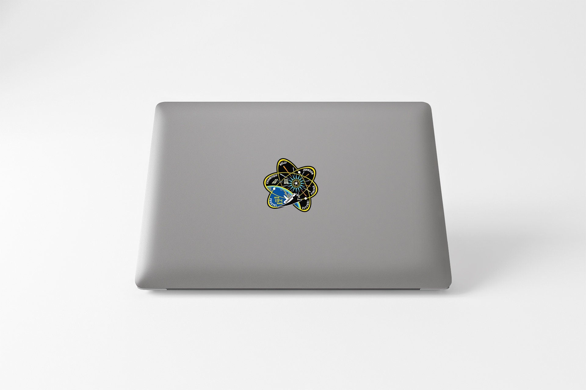 a laptop computer sitting on top of a white table