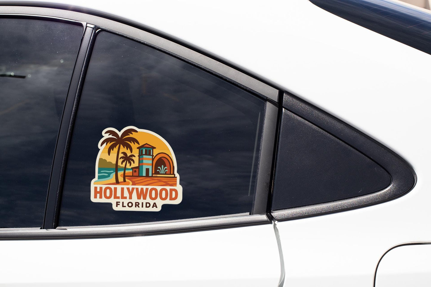 A sticker on the side of a car window, depicting a tropical beach scene with palm trees and a building, representing the location of Hollywood, Florida.