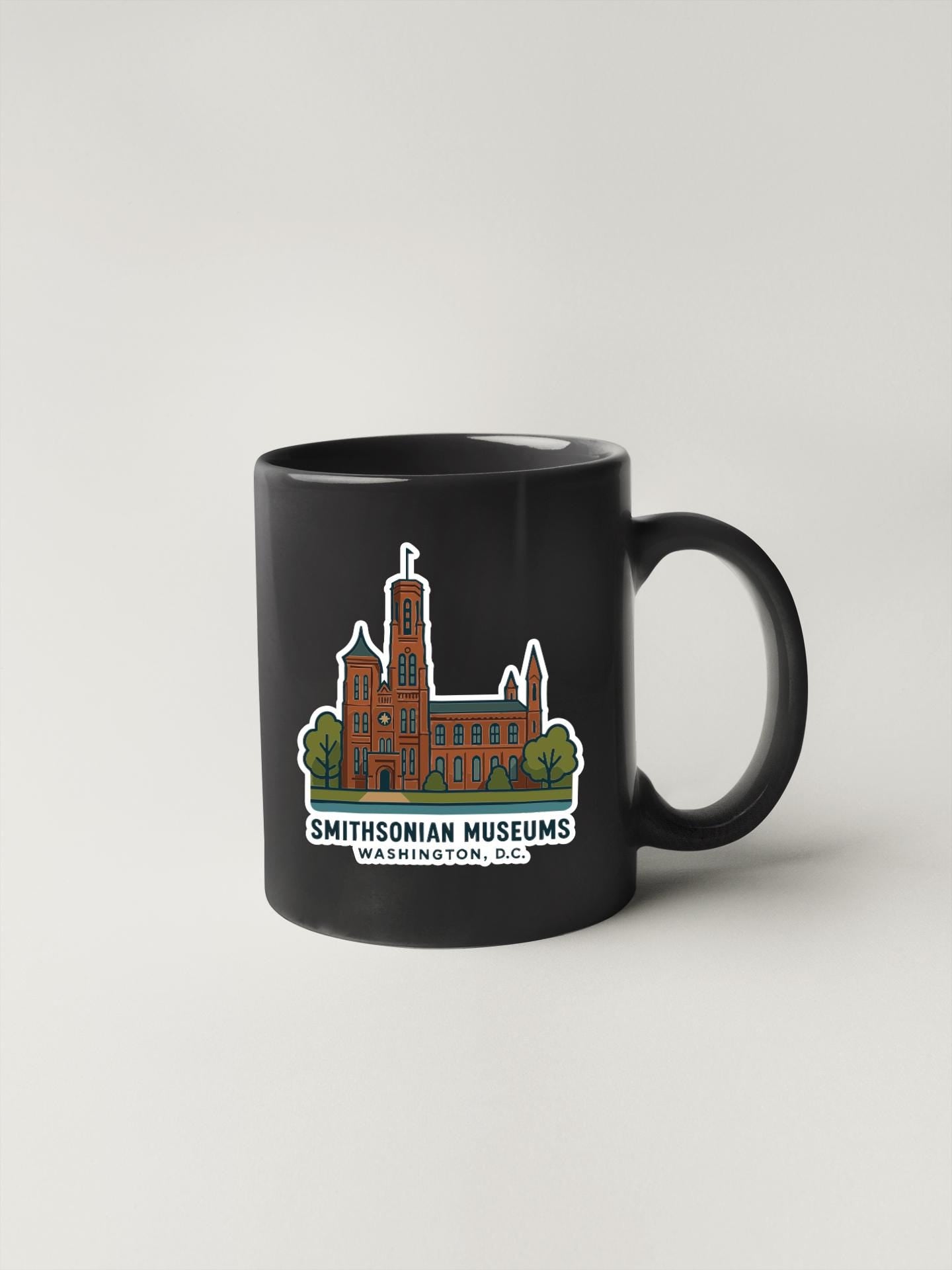 A black coffee mug with a graphic design depicting the Smithsonian museums in Washington, D.C.
