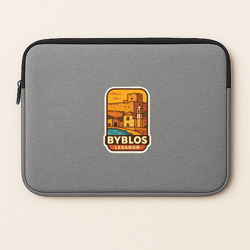 a gray laptop sleeve with a sticker depicting a cityscape and the text "BYBLOS LEBANON".