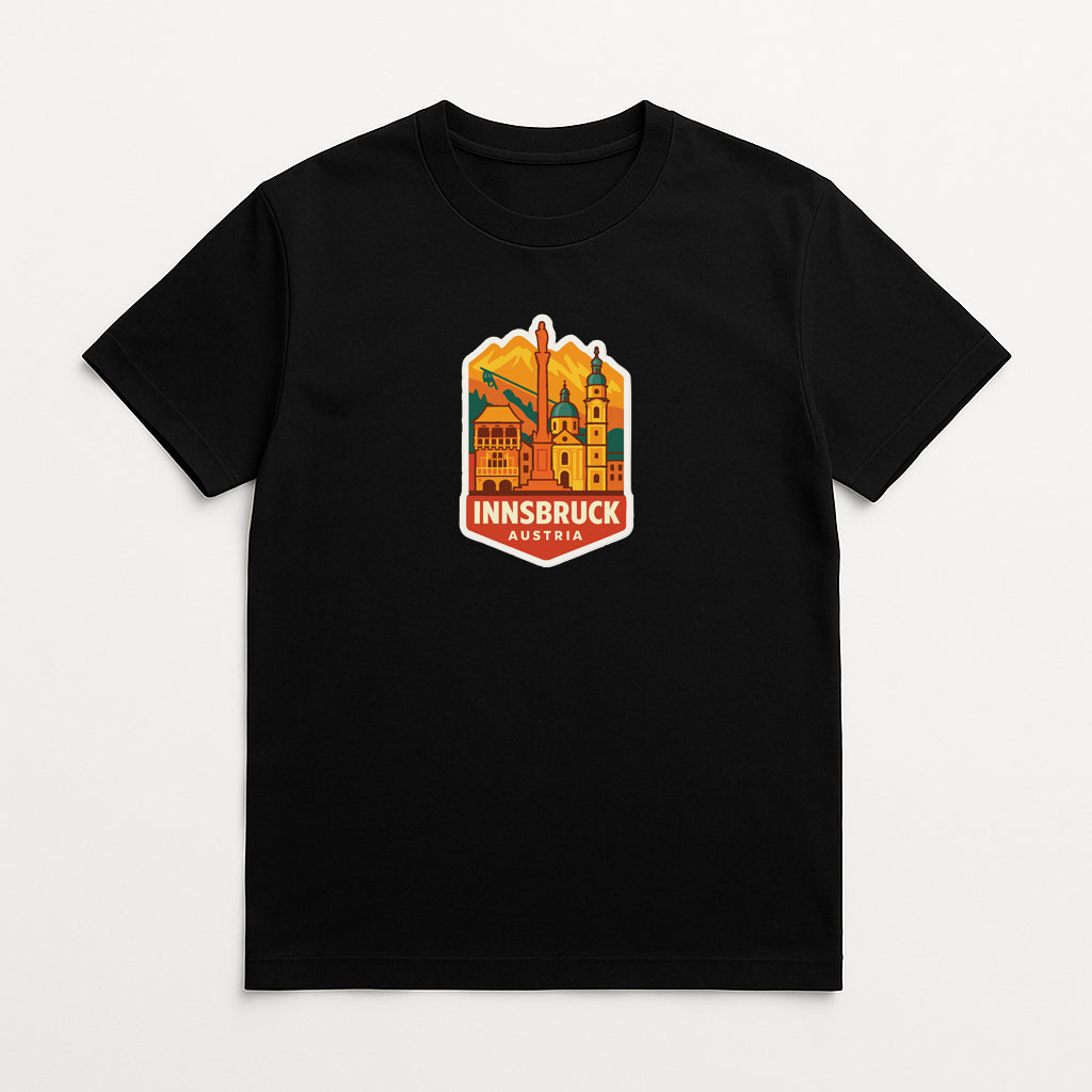 A black t-shirt with a graphic design depicting the Innsbruck, Austria, cityscape.