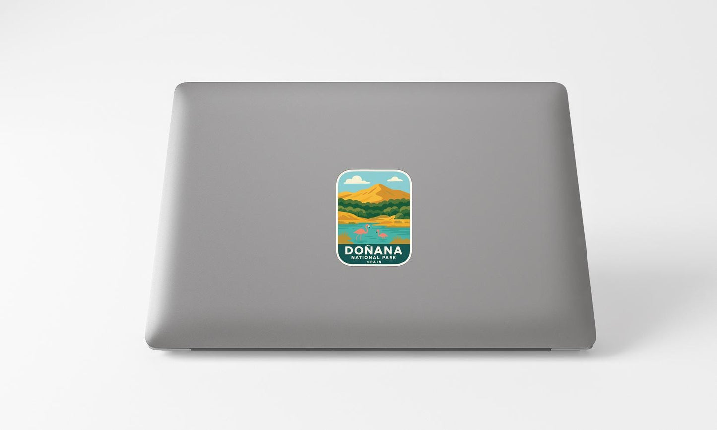 A sticker with a landscape and mountains on a laptop.