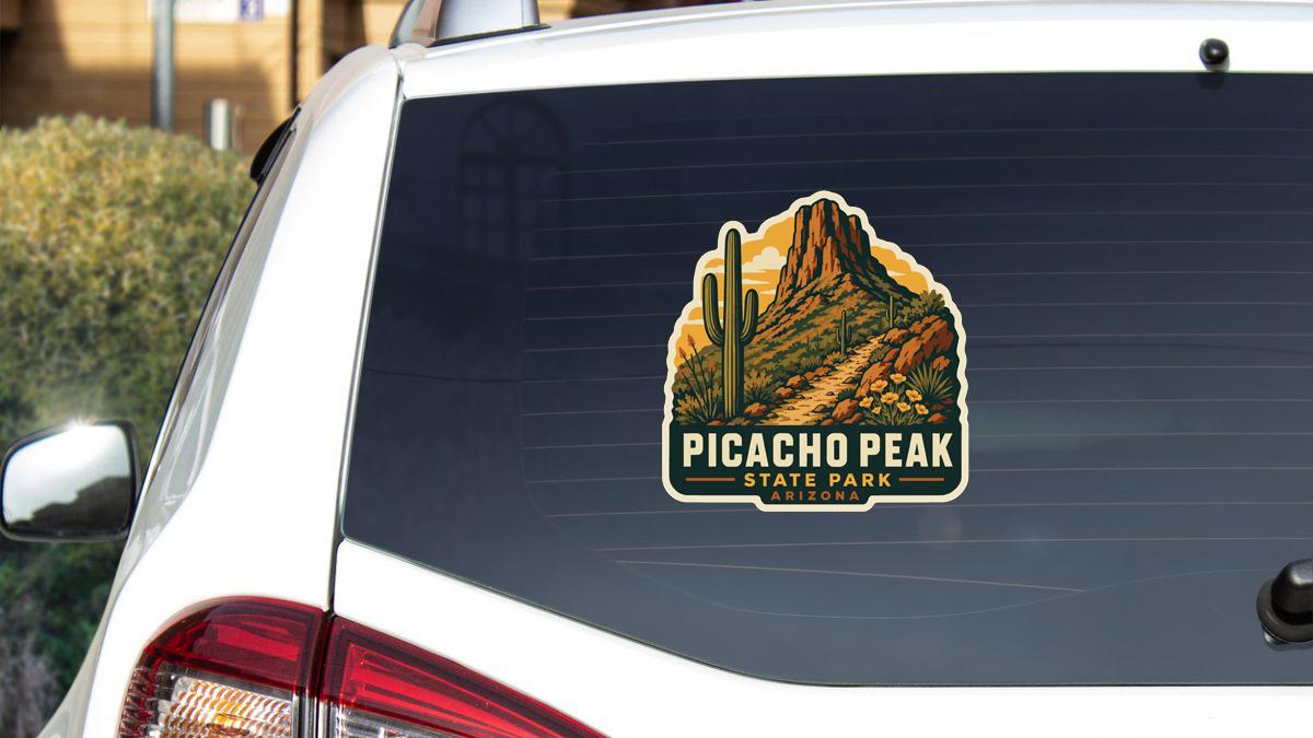 A sticker on the rear window of a car that says "PICACHO PEAK STATE PARK AUSTRALIA".