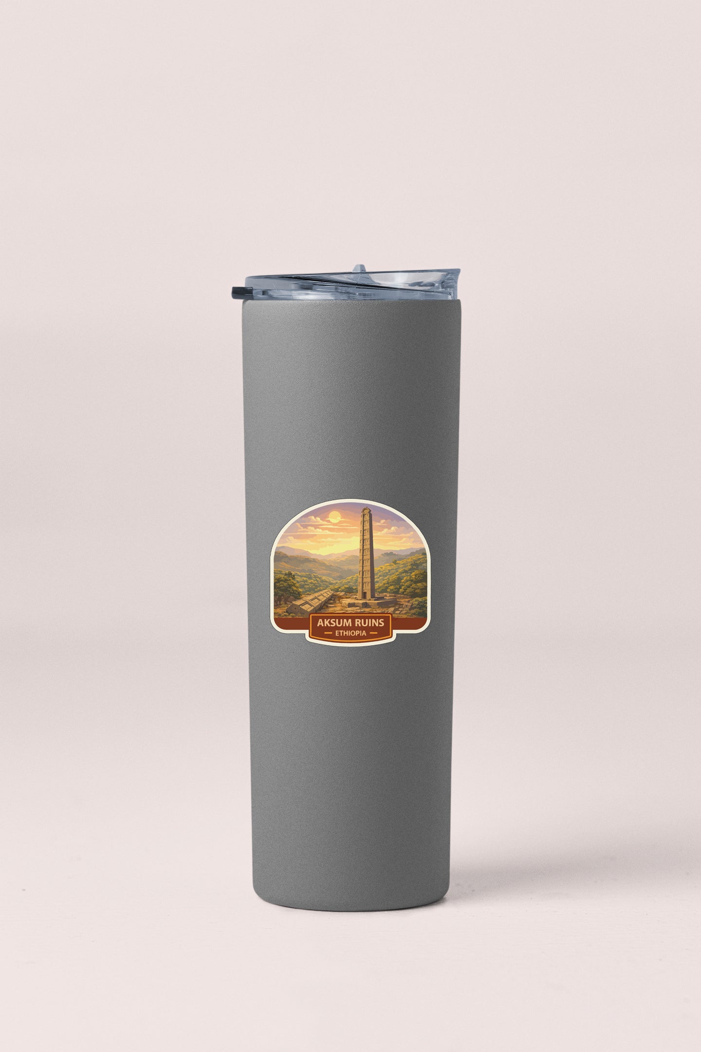 A gray cylindrical container with a lid and a label featuring an image of the Washington Monument.