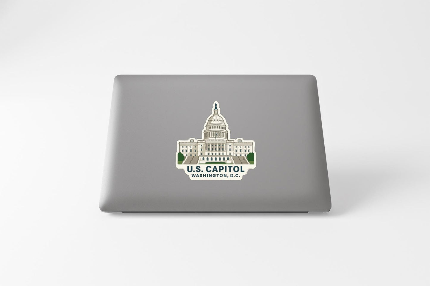 a sticker of the U.S. Capitol building on a laptop.