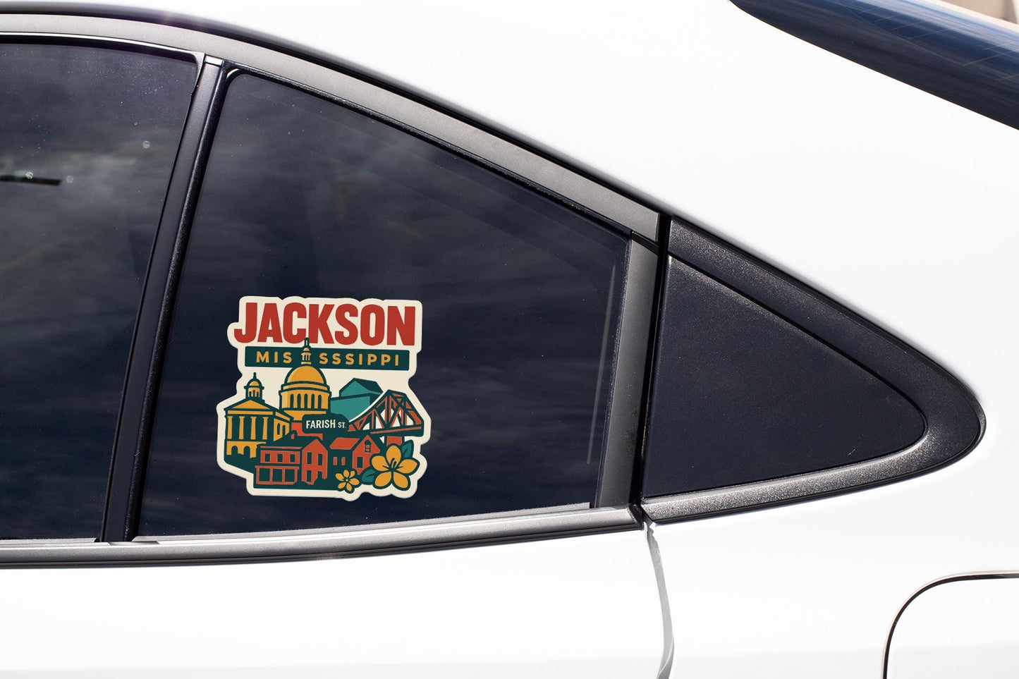 A car window with a sticker on it, featuring a colorful illustration of a cityscape with buildings and landmarks.