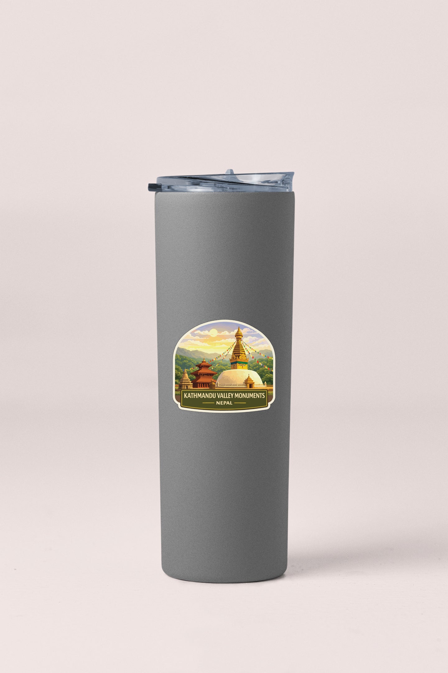 A gray insulated tumbler with a label depicting a scenic mountain landscape and the text "KATHMANDAN VALLEY MONUMENTS Nepal".