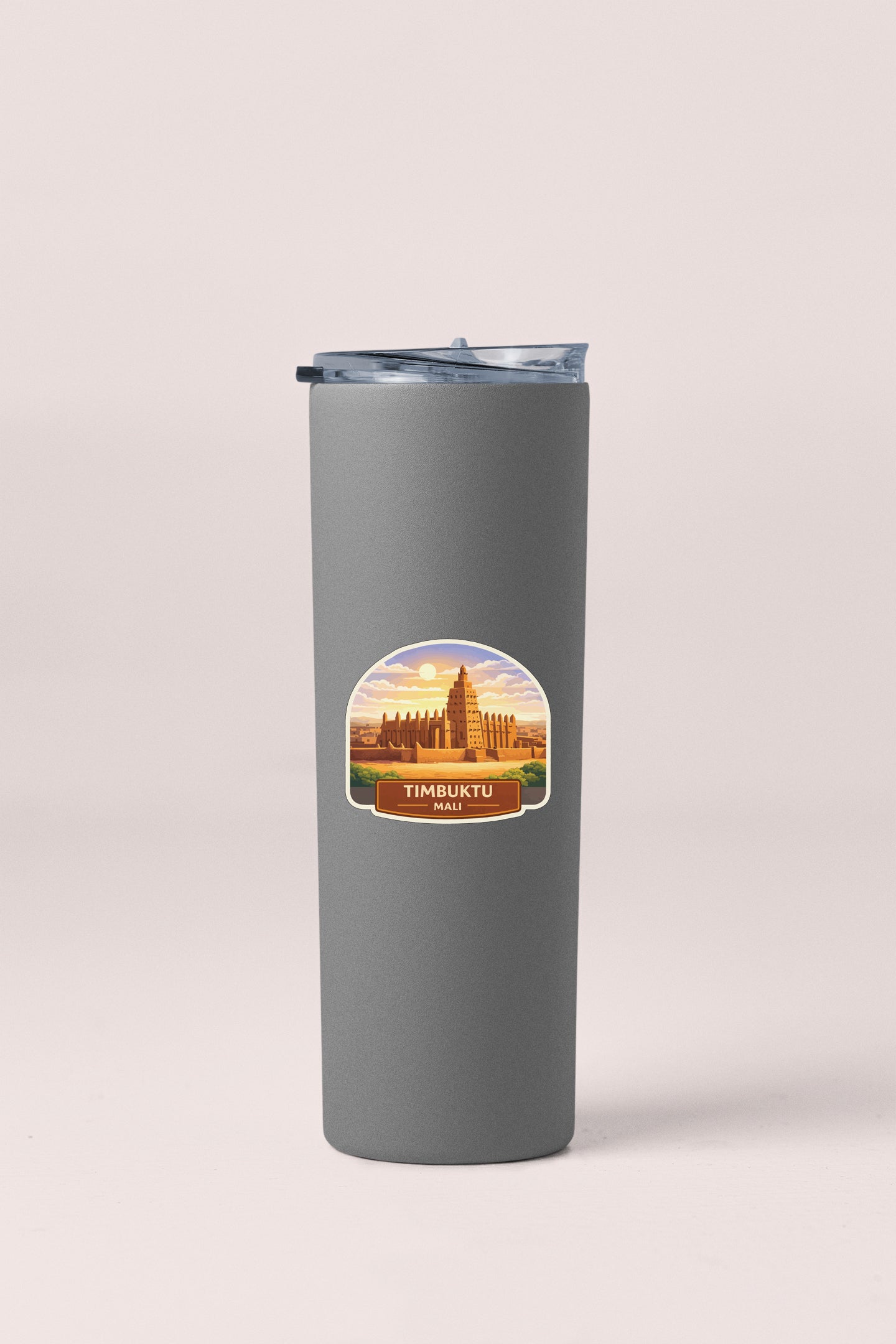 A gray insulated tumbler with a label featuring an illustration of a temple and the text "TIMBUKTU MALI".