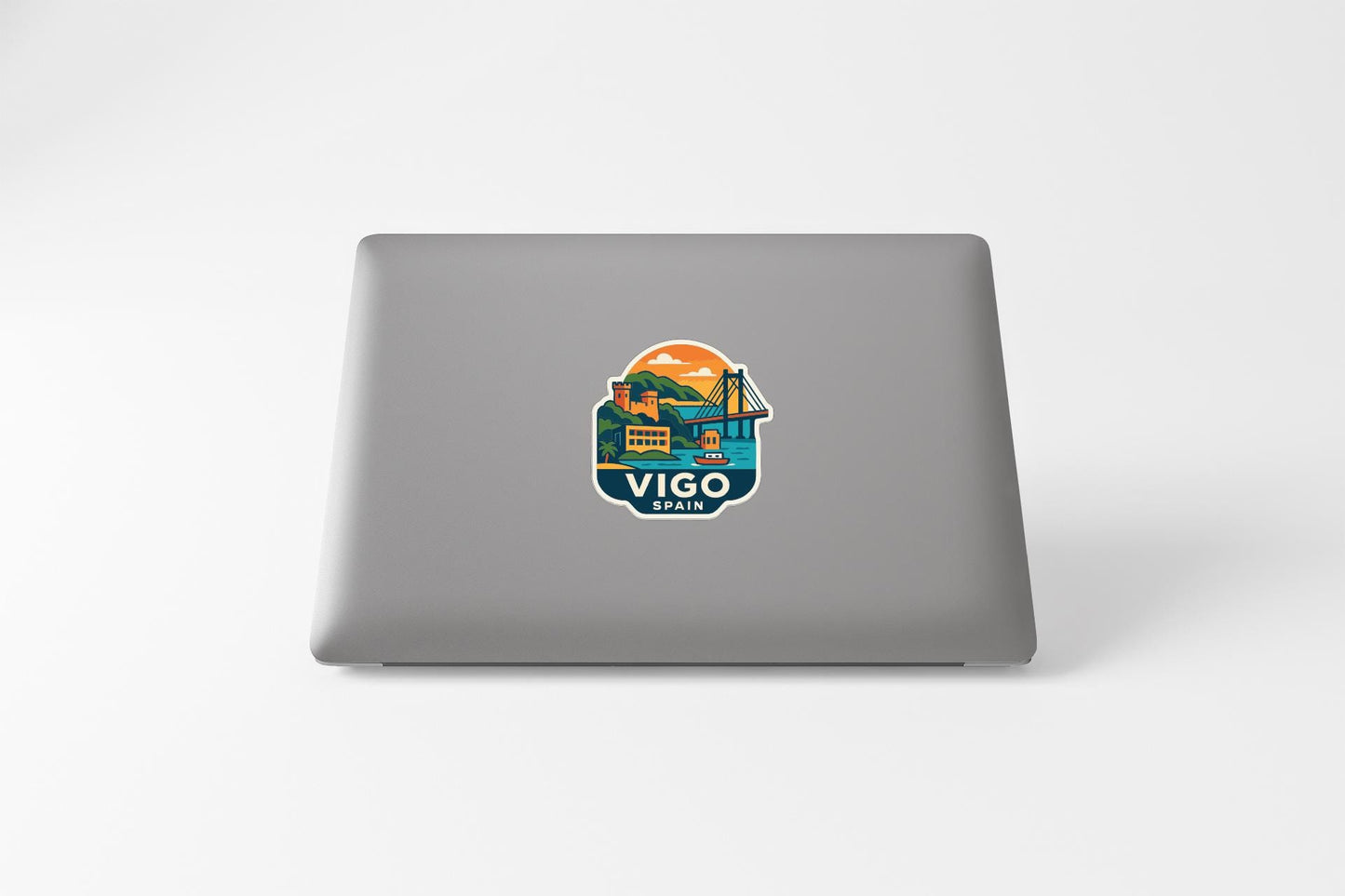 a sticker with a graphic of a bridge and mountains, along with the text "VIGO SPAIN" printed on it.