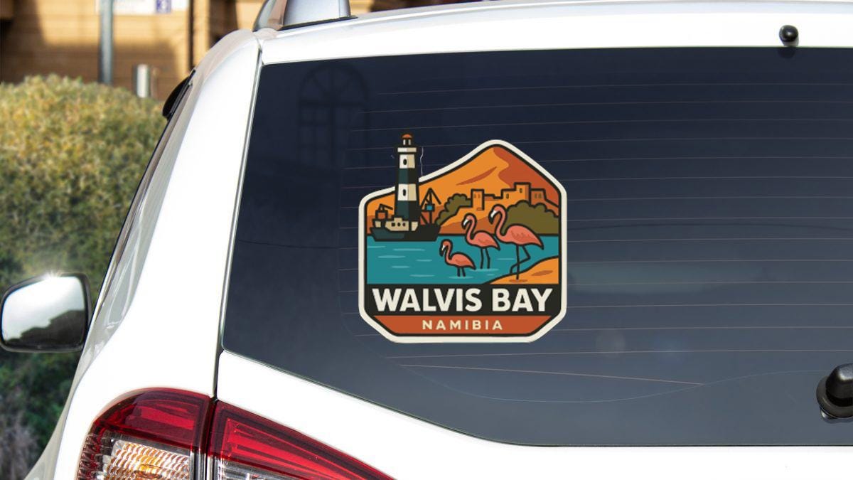 a sticker on the rear window of a car that says "WALVIS BAY NAMIBIA".