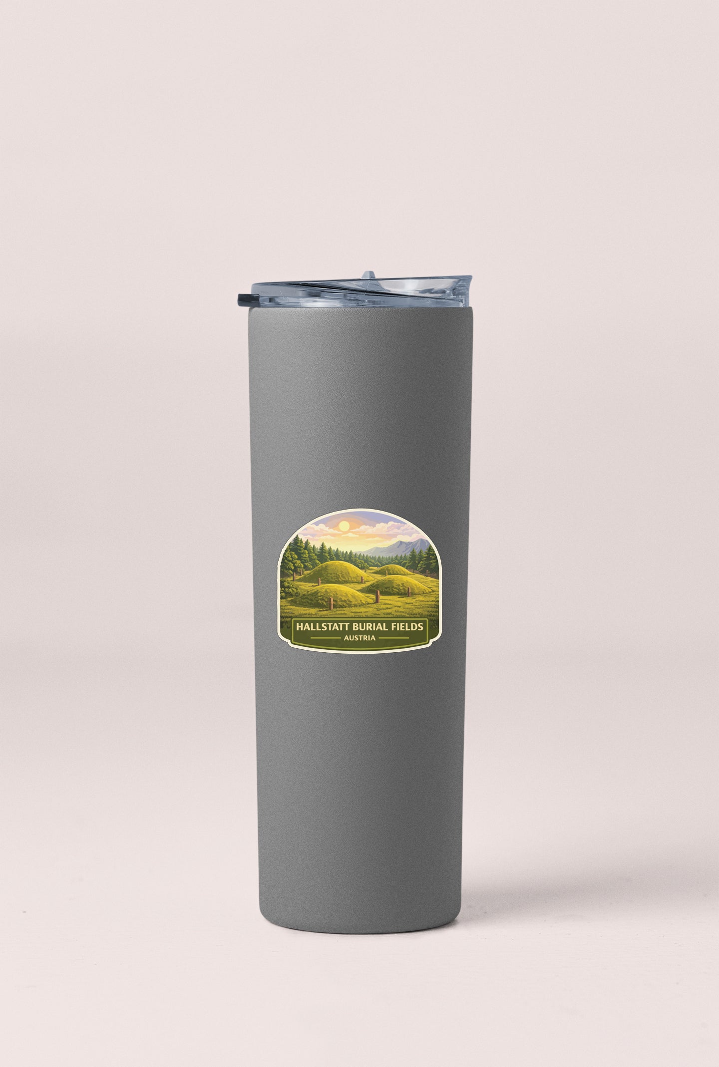 A gray cylindrical thermos with a label that reads "Hallsattal Burial Fields Austria".