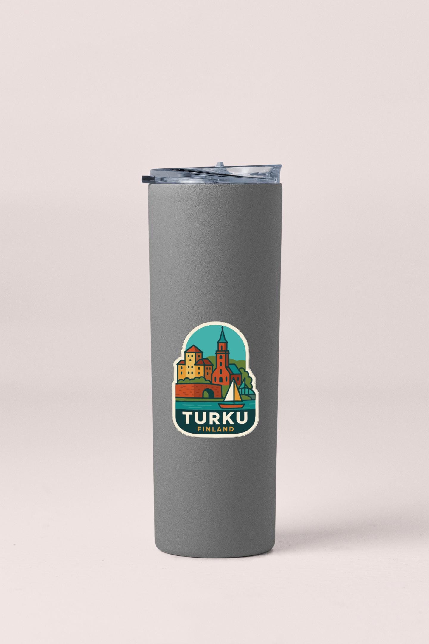 A gray insulated tumbler with a sticker depicting a cityscape and the text "TURKU FINLAND".