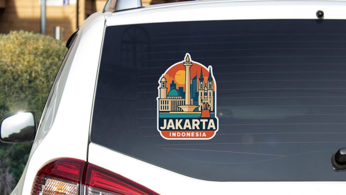 A sticker on the rear window of a car that says "JAKARTA INDONESIA".