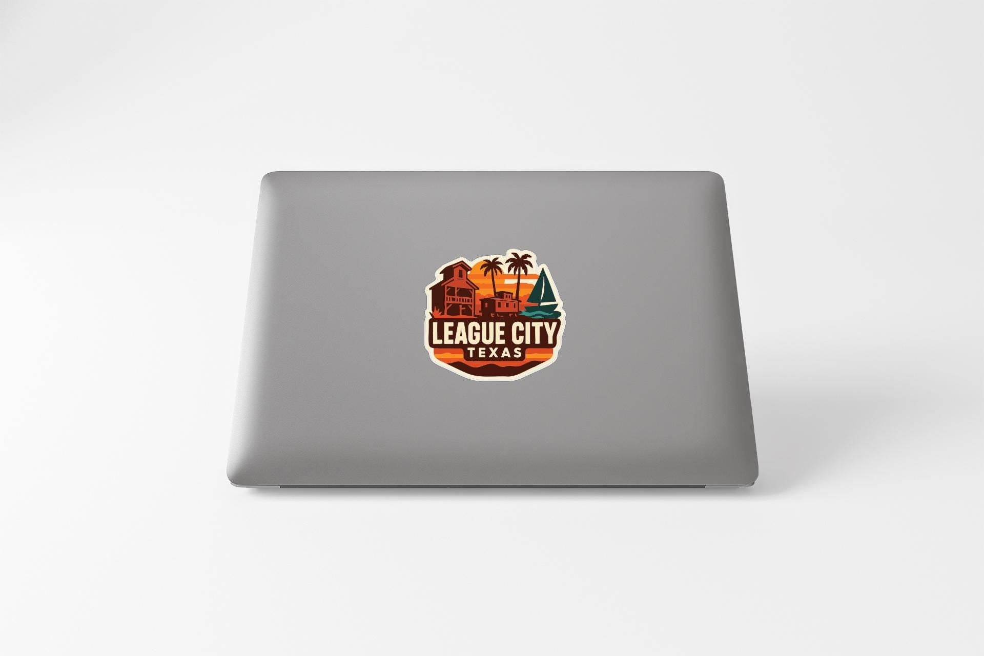 a sticker with a logo for League City, Texas.