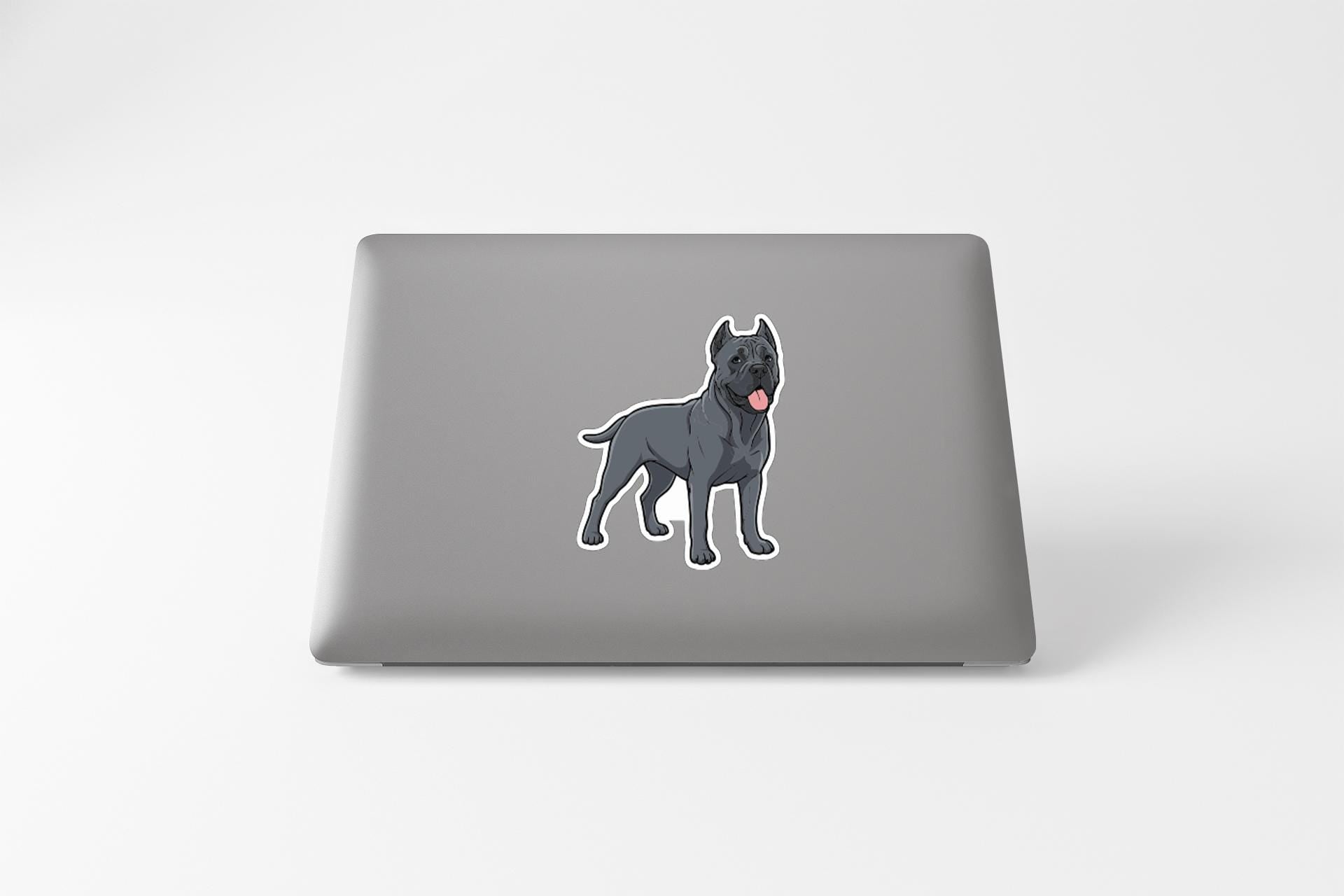 A sticker of a dog on the back of a laptop computer.