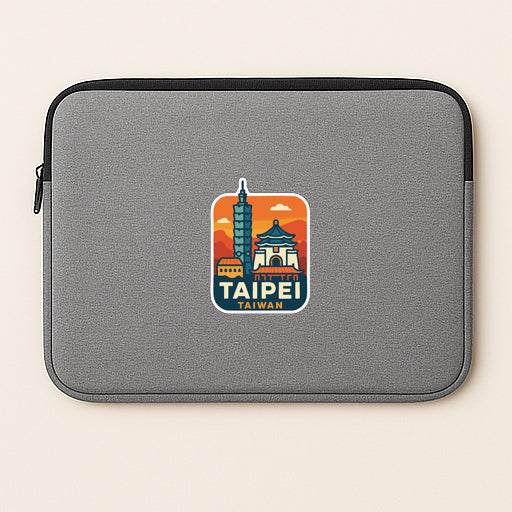 A gray laptop sleeve with a sticker of a city skyline and the text "TAIPEI TAIWAN" printed on it.
