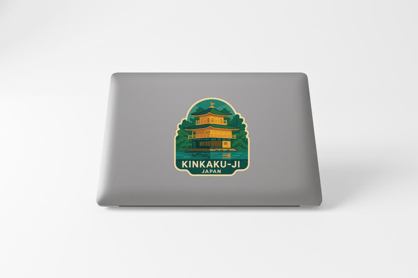 A sticker depicting the Kinkaku-ji temple in Japan, with the text "KINKAU-JI JAPAN" printed on it.