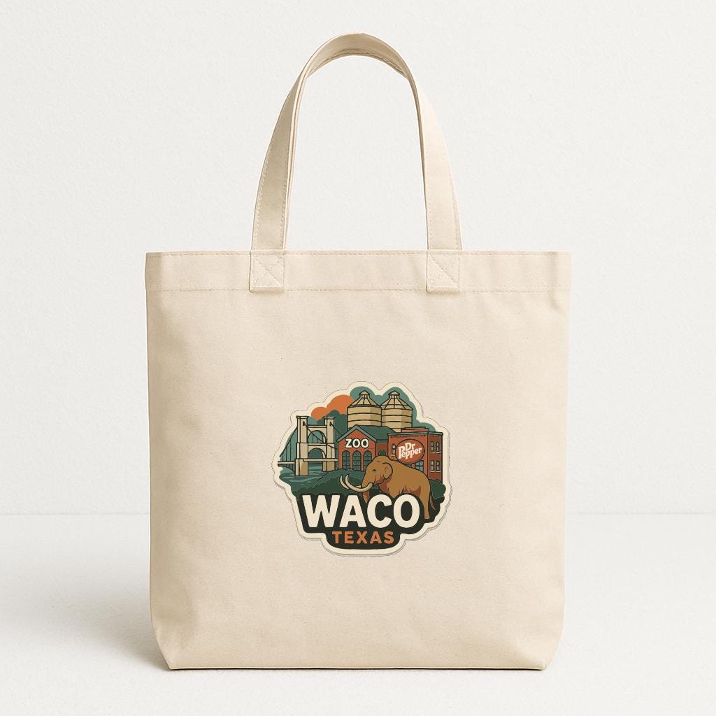 A beige tote bag with a printed design featuring a cityscape and the text "Waco, Texas" printed on it.