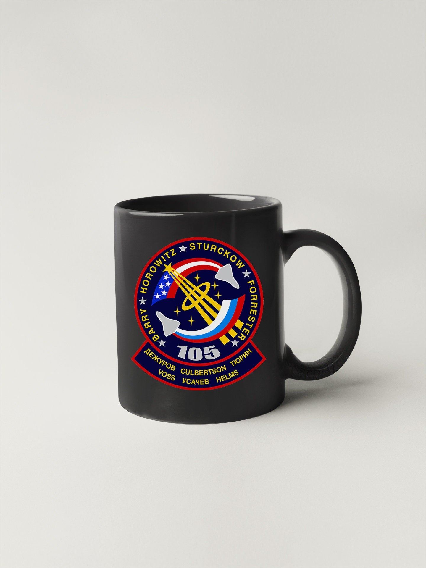 a black coffee mug with a logo on it