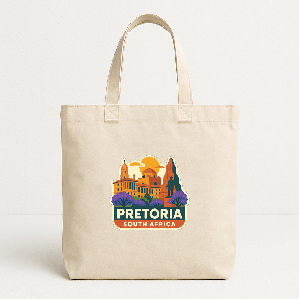 A beige tote bag with a printed design depicting Pretoria, South Africa, featuring a cityscape with buildings and trees.