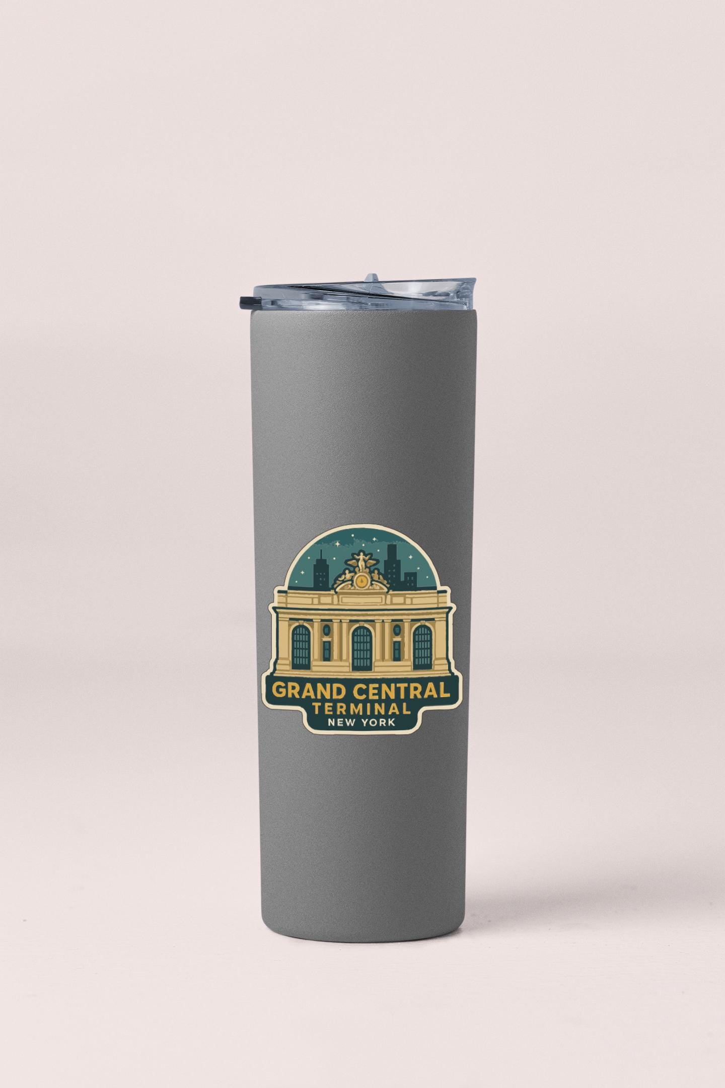 A gray tumbler with a logo depicting the Grand Central Terminal in New York.