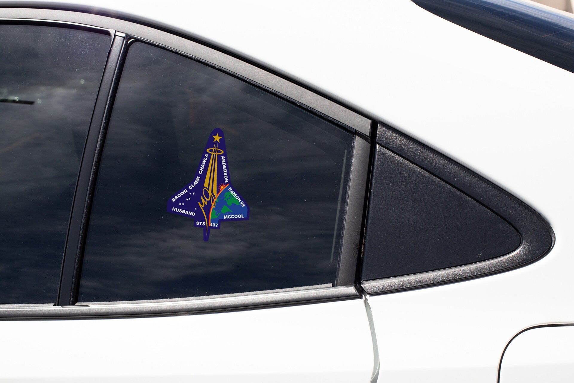 a side view mirror of a car with a christmas tree on it
