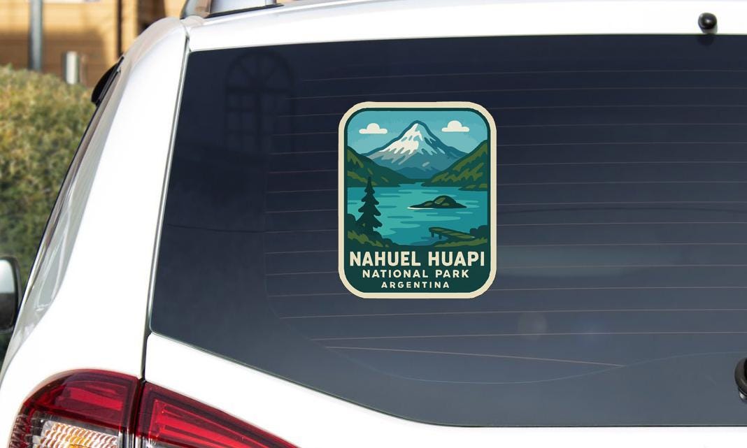A sticker on the rear window of a car that says "Nahuel Huapi National Park Argentina".