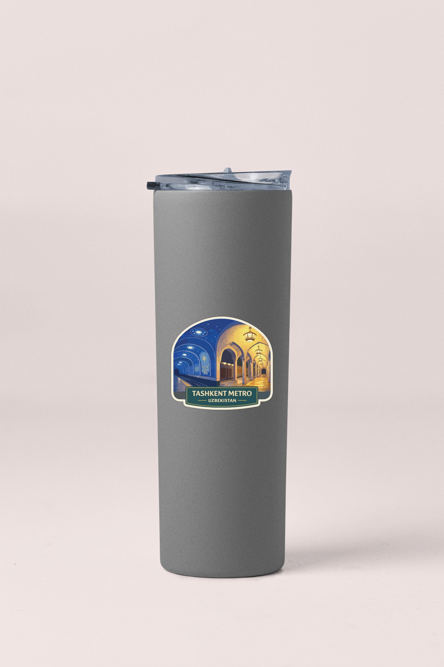 A gray cylindrical container with a lid and a label that reads "Tashkent Metro" and "Urukshnaya".