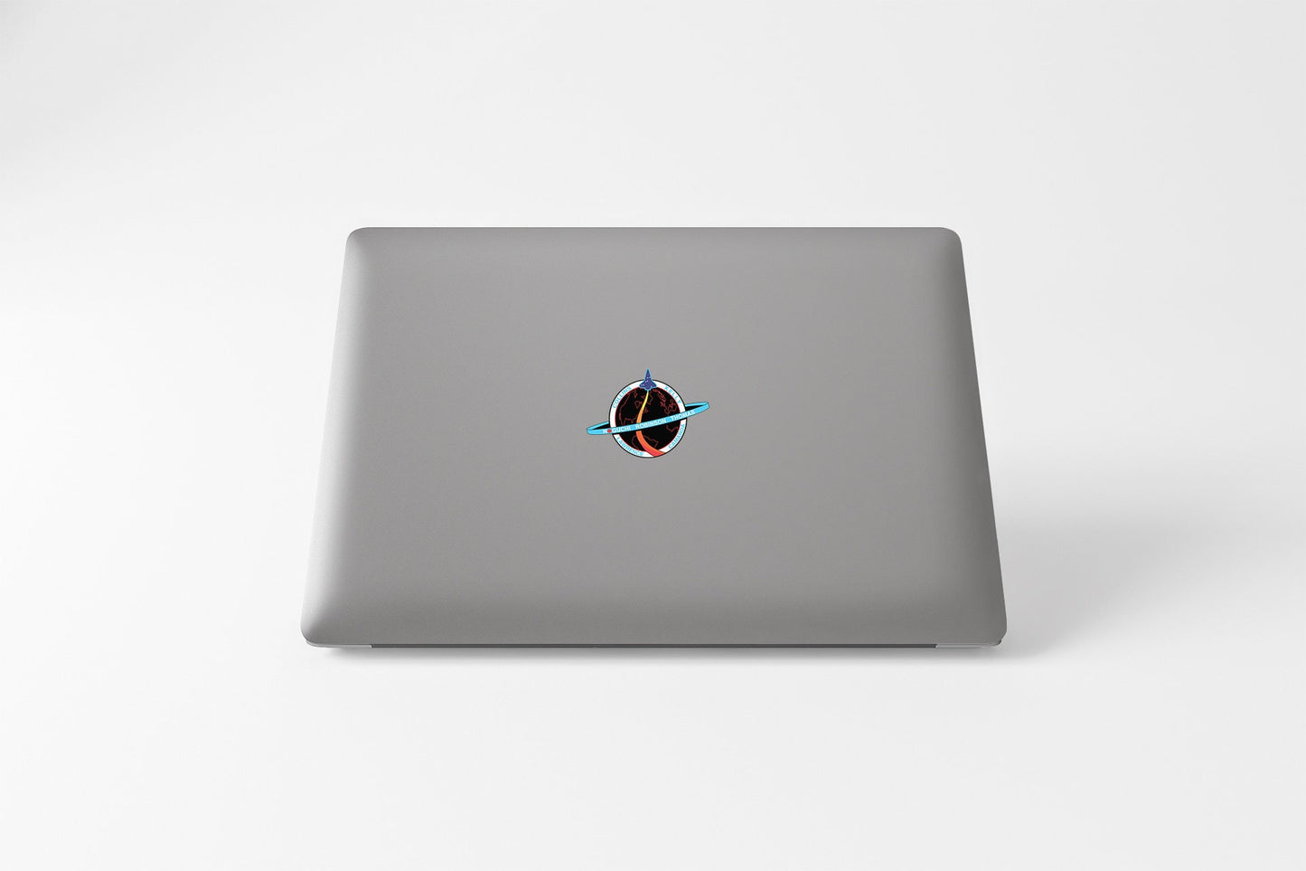 a laptop computer sitting on top of a white table