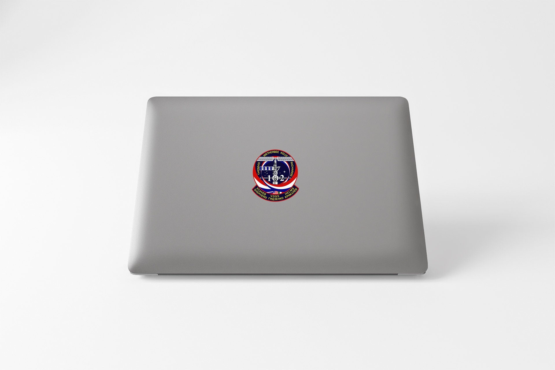 a laptop with a picture of a person's face on it