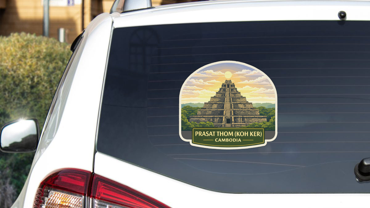 A sticker on the rear window of a white car, depicting the Prasat Thom (Koh Ker) temple in Cambodia.