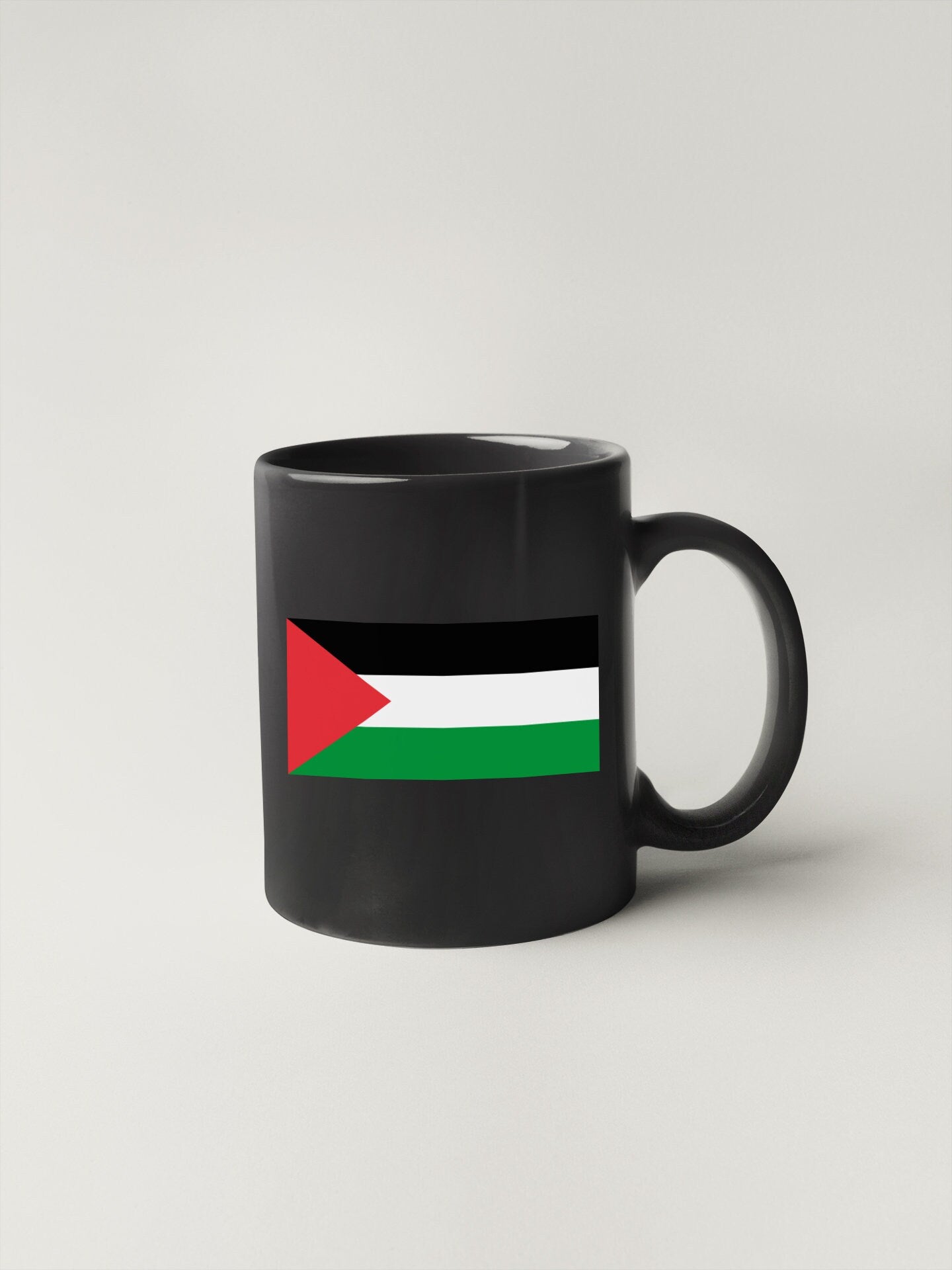 a black mug with the flag of the united states of jordan