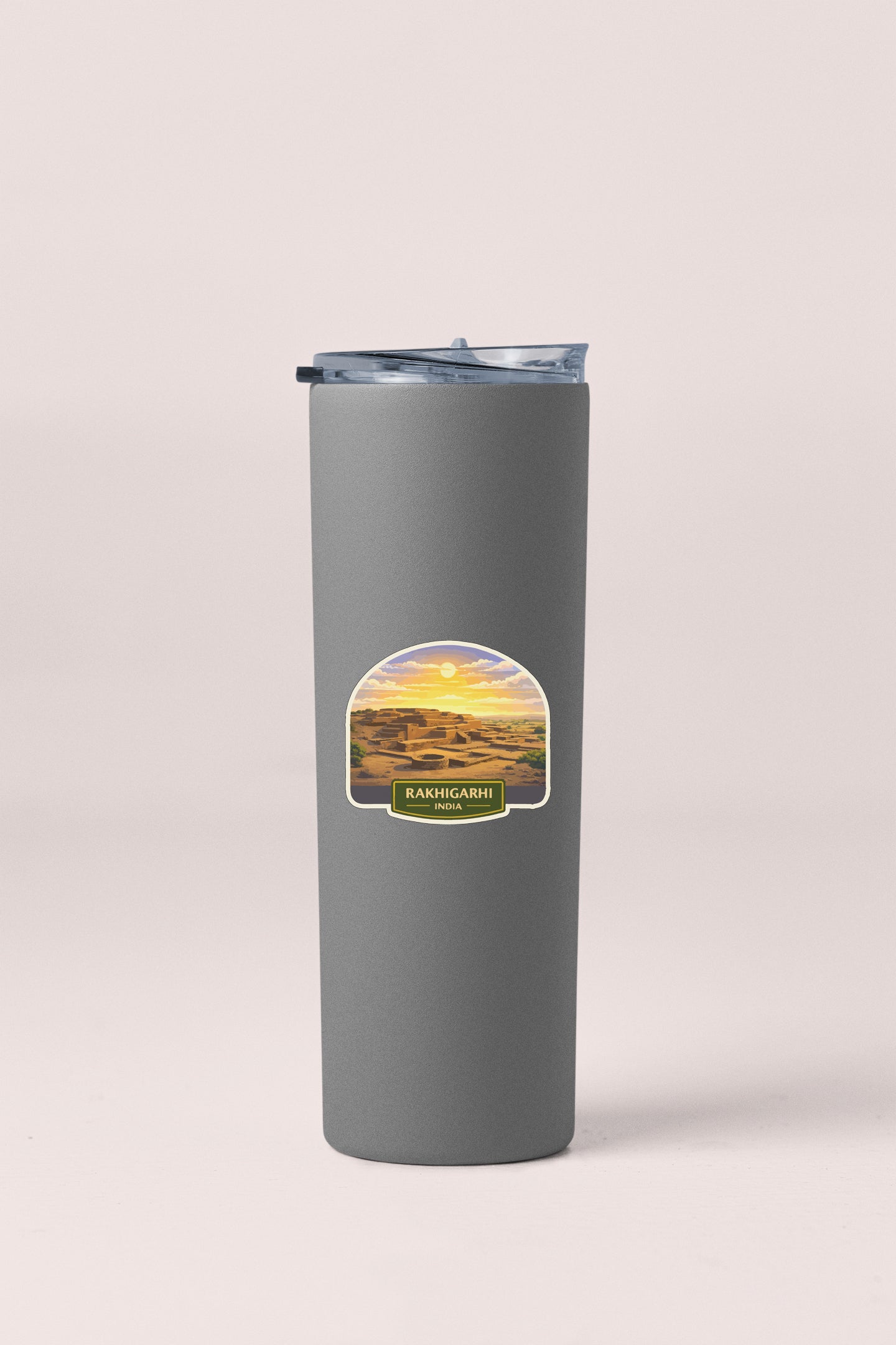 A gray cylindrical container with a lid and a label that says "Rakhi gorge, India".