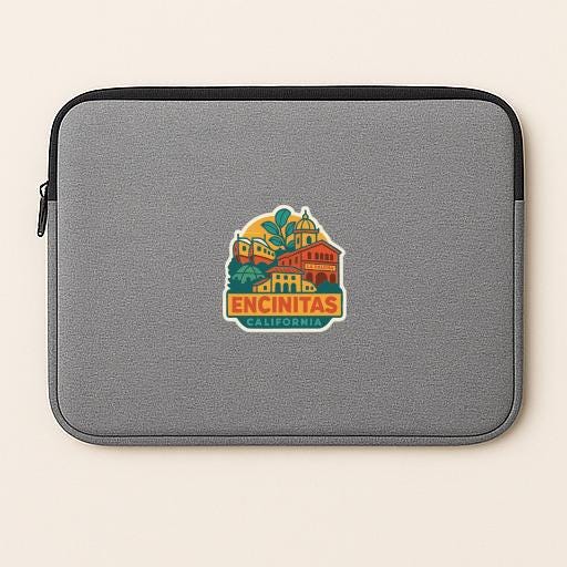 A gray laptop sleeve with a colorful graphic of a cityscape and the text "ENCINITAS, CALIFORNIA" printed on it.