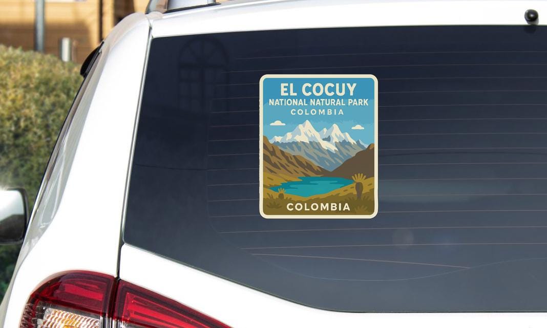 A sticker on the rear window of a car that says "EL COCUY NATIONAL PARK COLOMBIA".