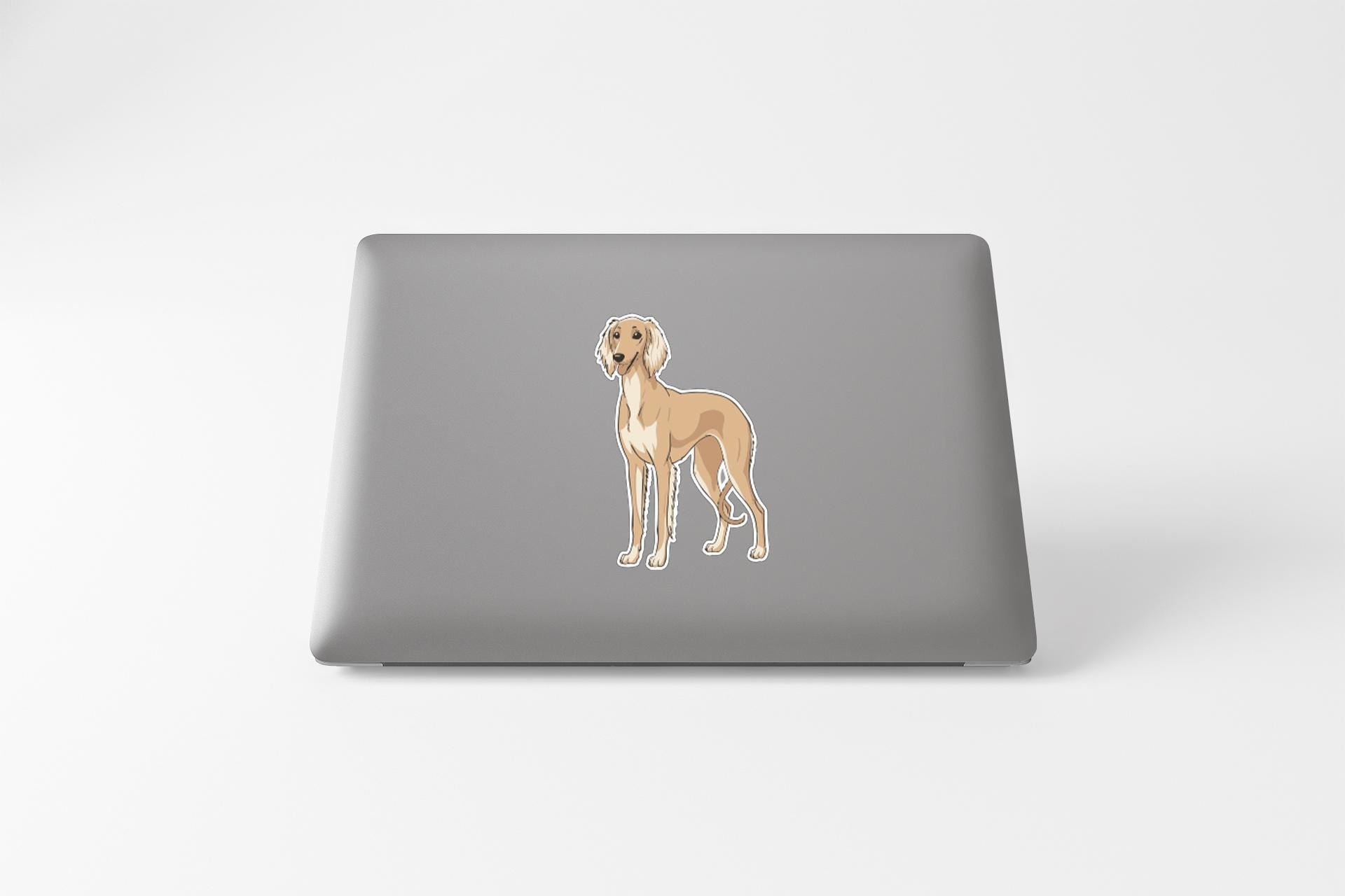 a sticker of a dog on the back of a laptop.