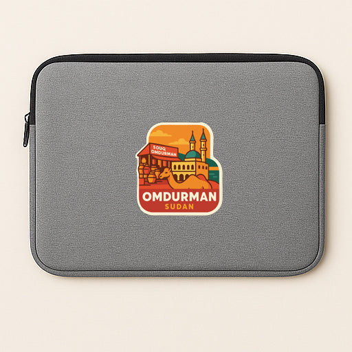 A gray laptop sleeve with a sticker depicting the city of Omdurman, Sudan.