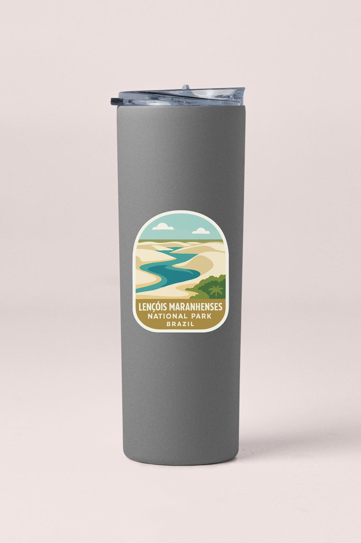 A gray tumbler with a label that says "LENCOIS MARANHENESES NATURAL PARK BRASIL".