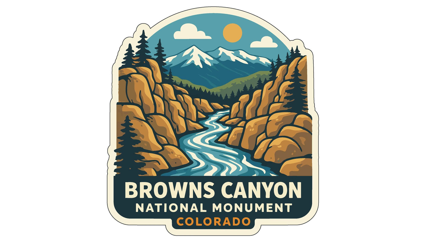 a sticker or emblem with a scenic landscape of mountains, a river, and pine trees. The text "Browns Canyon National Monument, Colorado" is prominently displayed, indicating the location and name of the landmark.