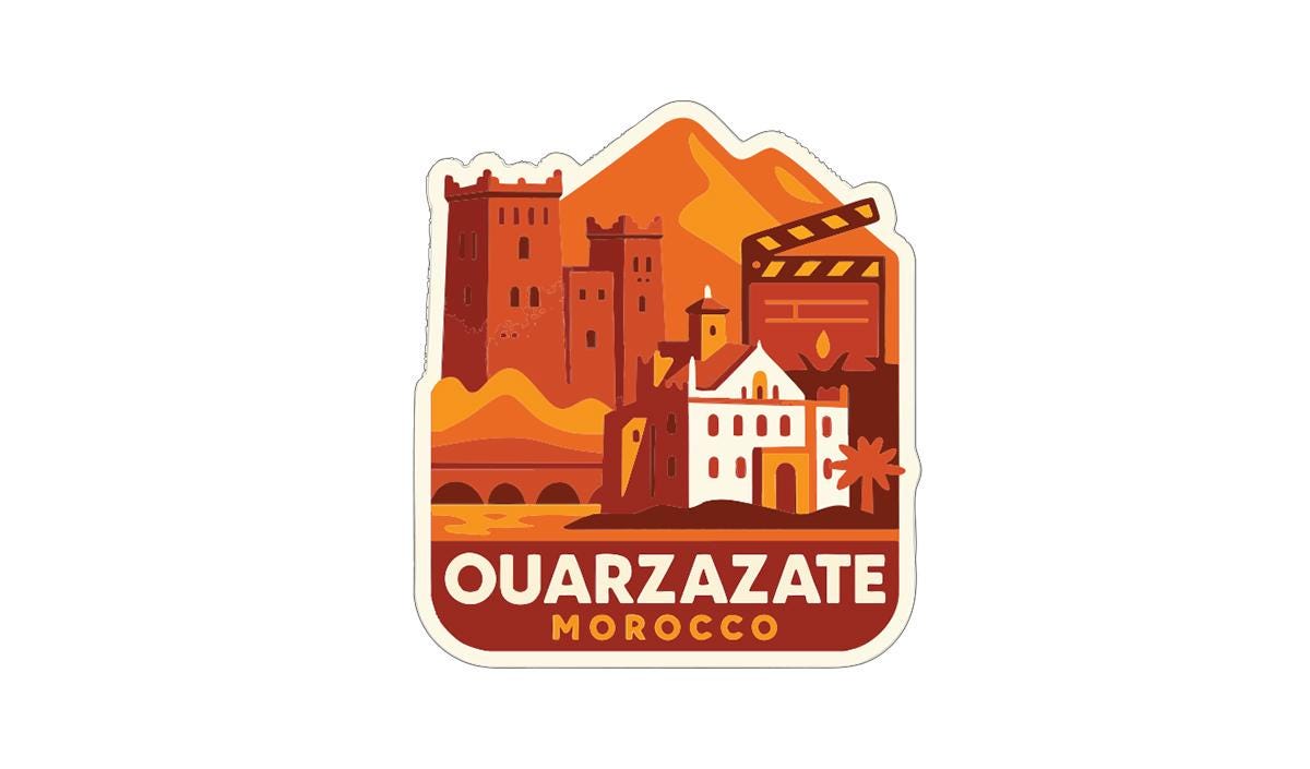 a sticker or emblem with a stylized illustration of a cityscape, including buildings, mountains, and a film reel. The text "OUARZAZATE MOROCCO" is prominently displayed, indicating the location or theme of the image.